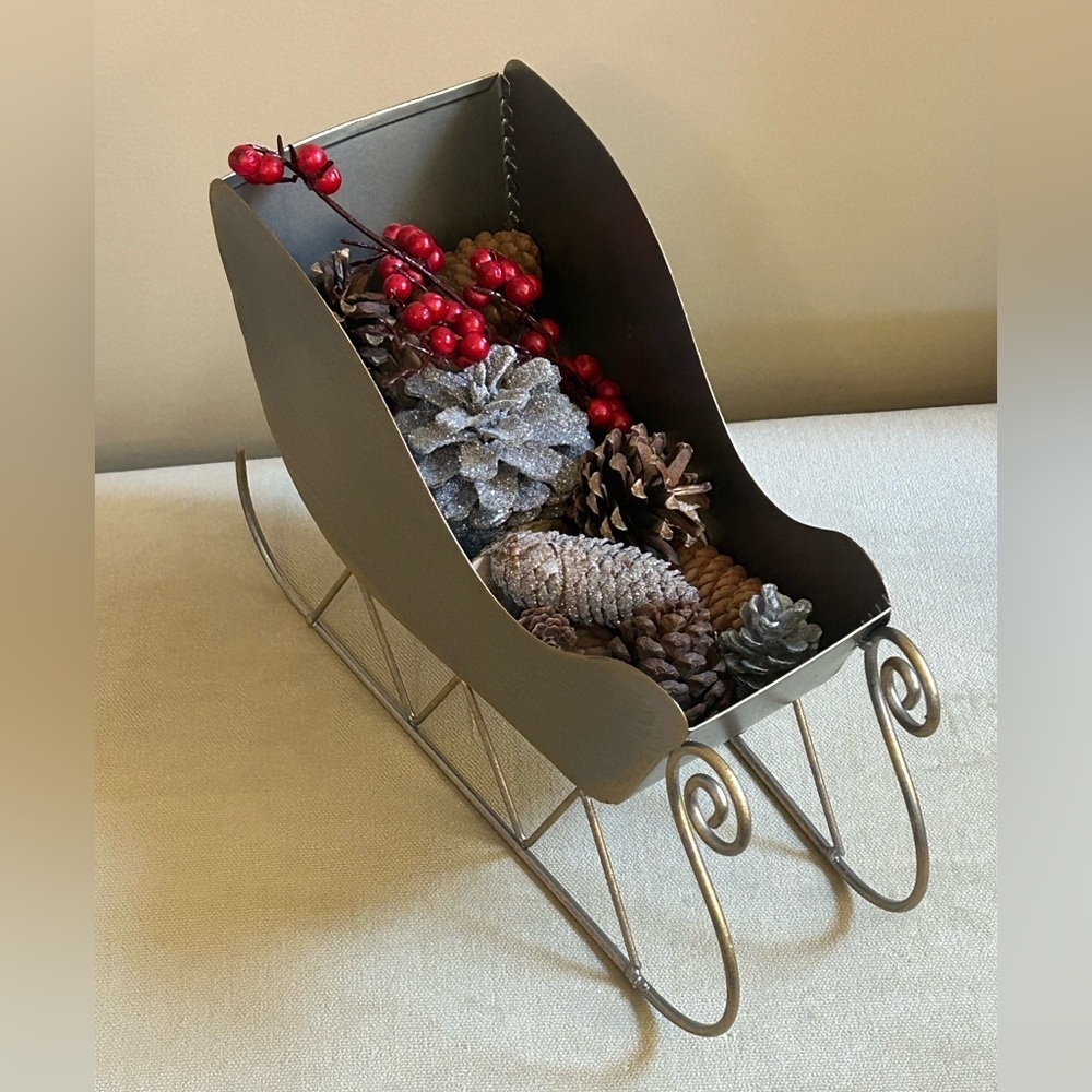 Festive Gray Sleigh with Pinecones and Red Accents
